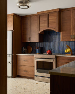 Custom concealed appliance garage cabinetry in modern South Jersey kitchen remodeling design